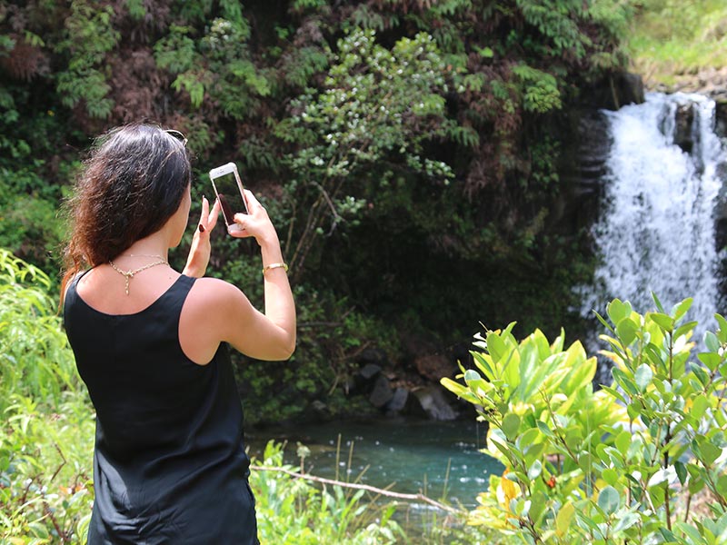 See waterfalls on the Road to Hana