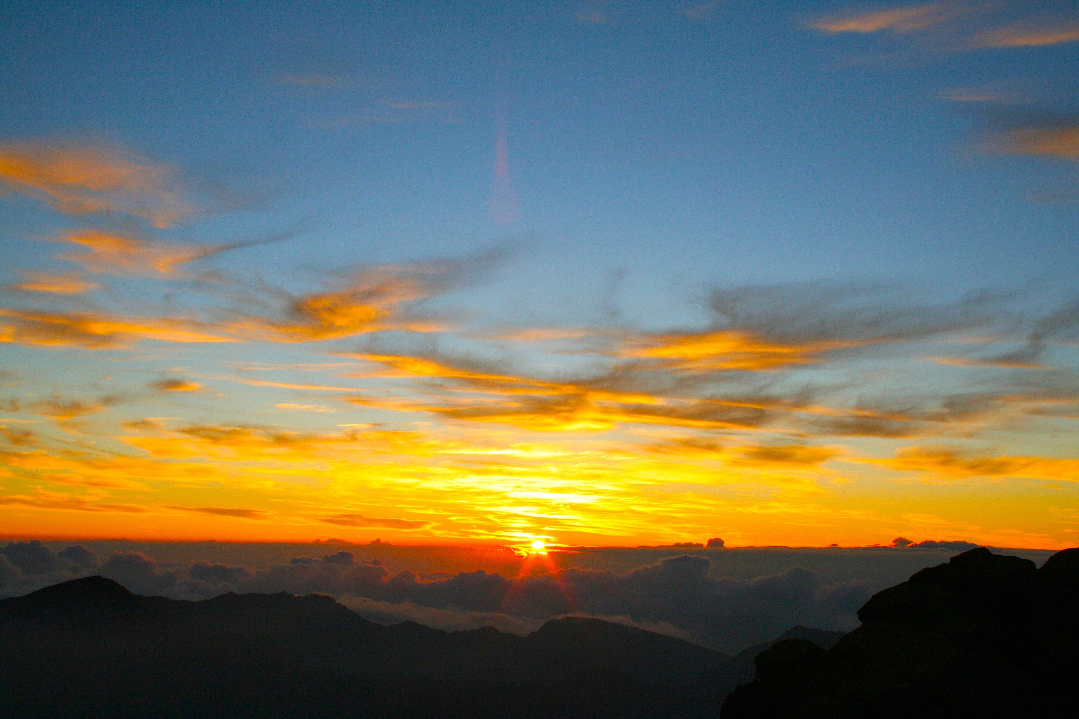 A view of the Hawaii sunrise from the peak of Haleakala. 