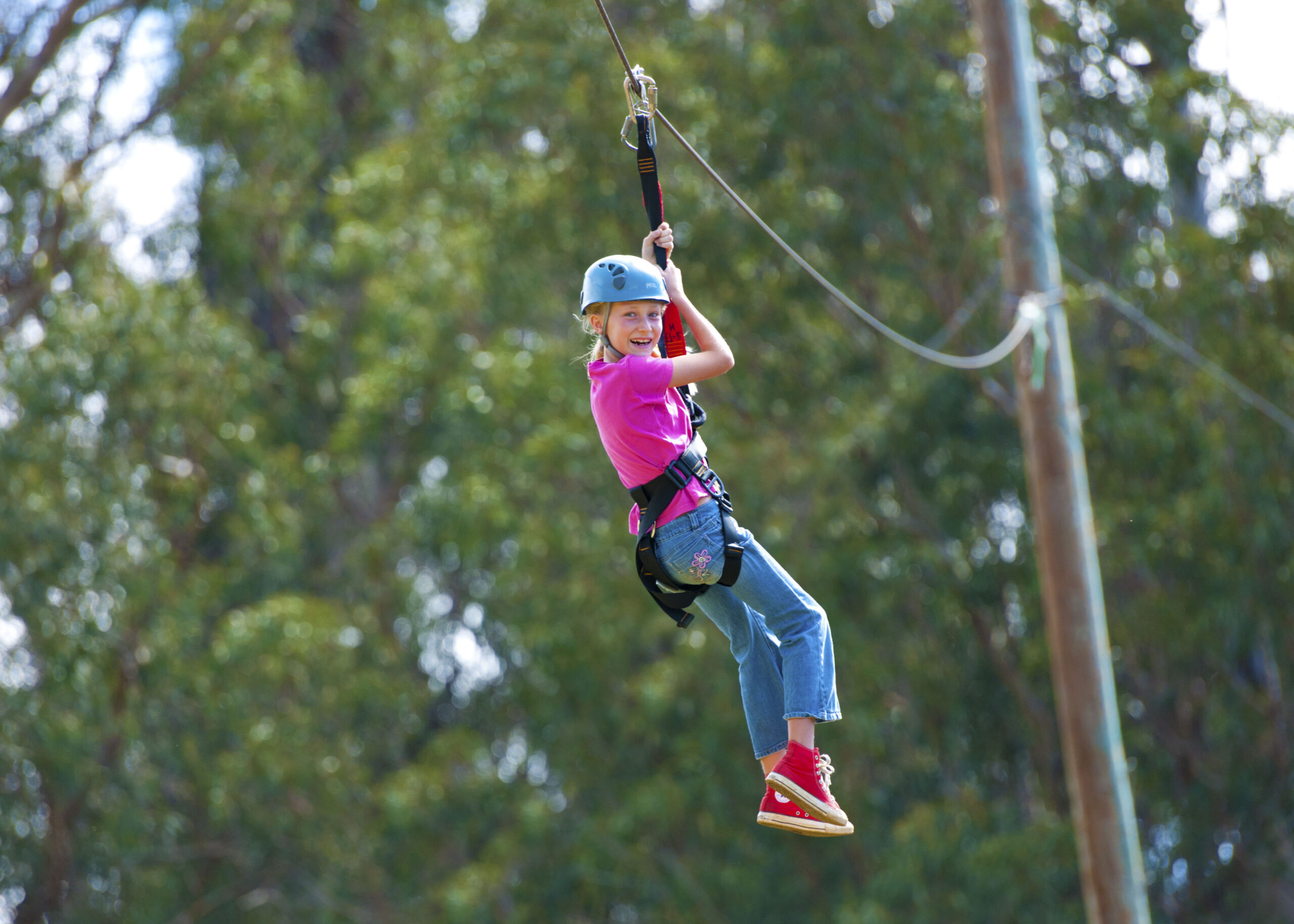 Girl ziplining at skyline eco adventures in maui