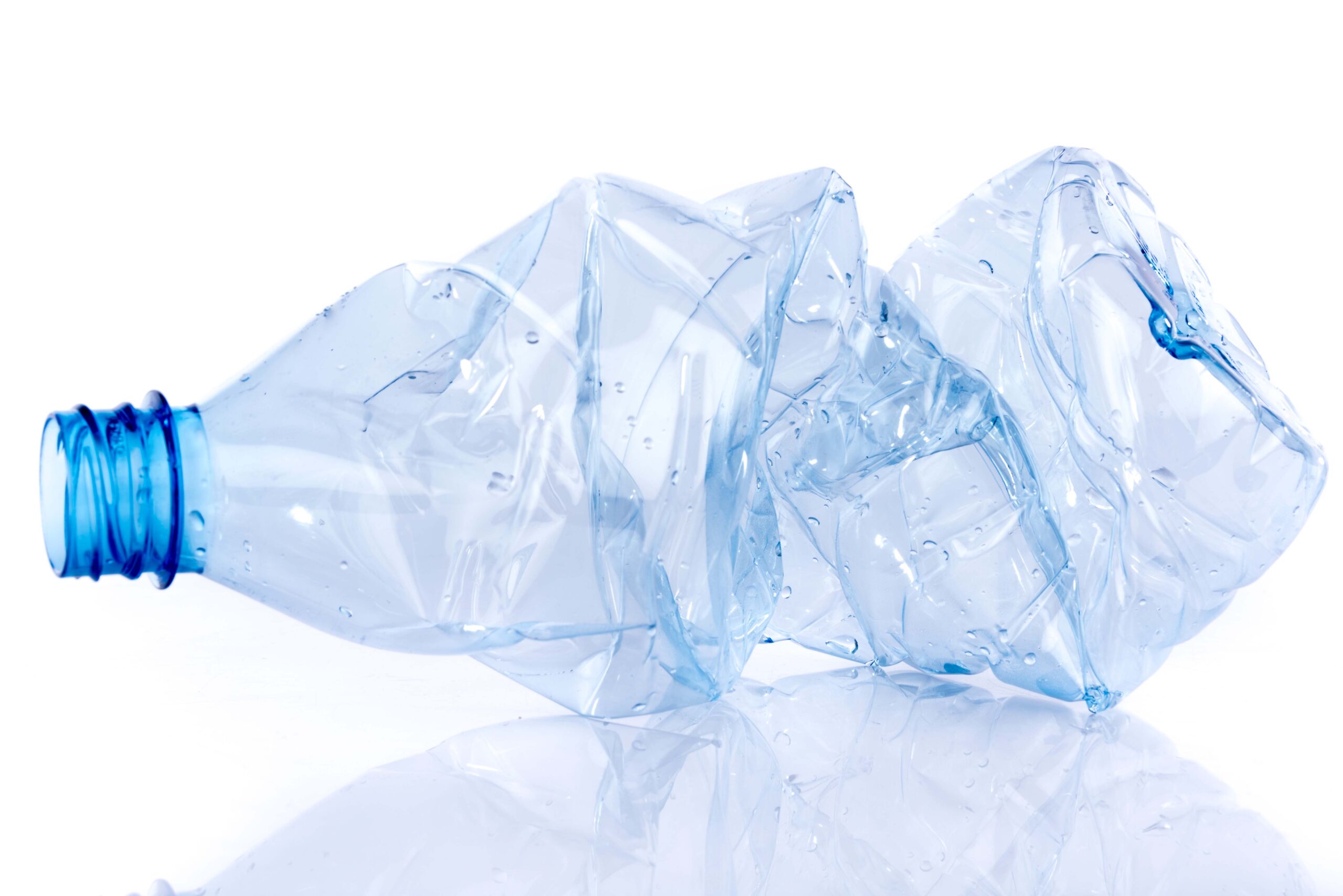 Crushed plastic bottle, isolated on white
